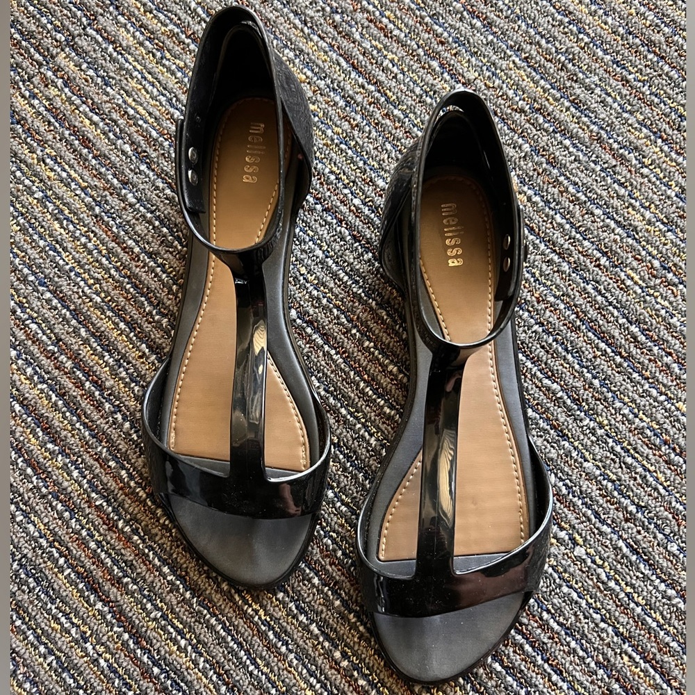 Black Melissa flats with ankle strap.
